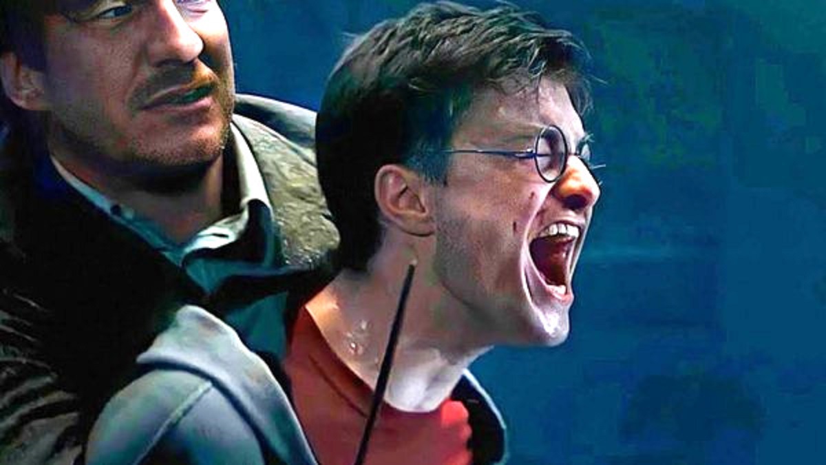 Harry Potter screaming while Remus Lupin holds him back
