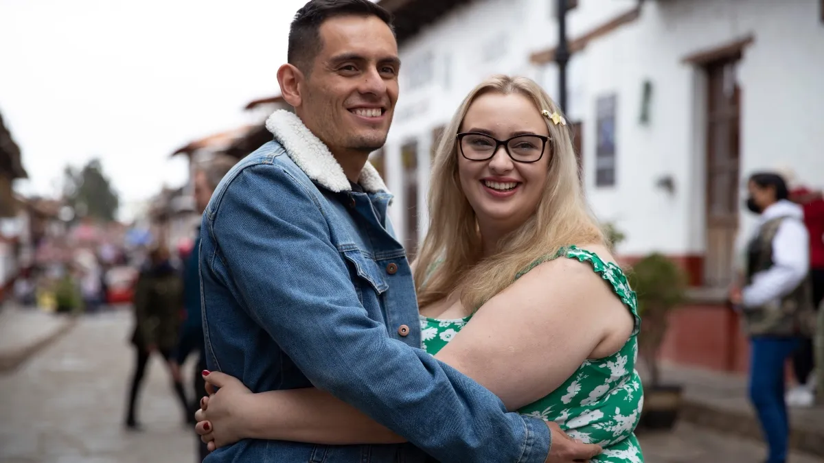 Kadie and Alejandro embrace on a British street,