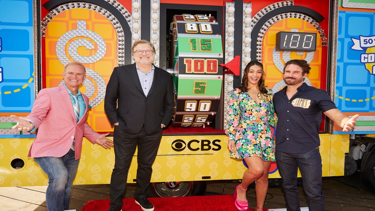 The cast of "The Price is Right" beside the wheel.