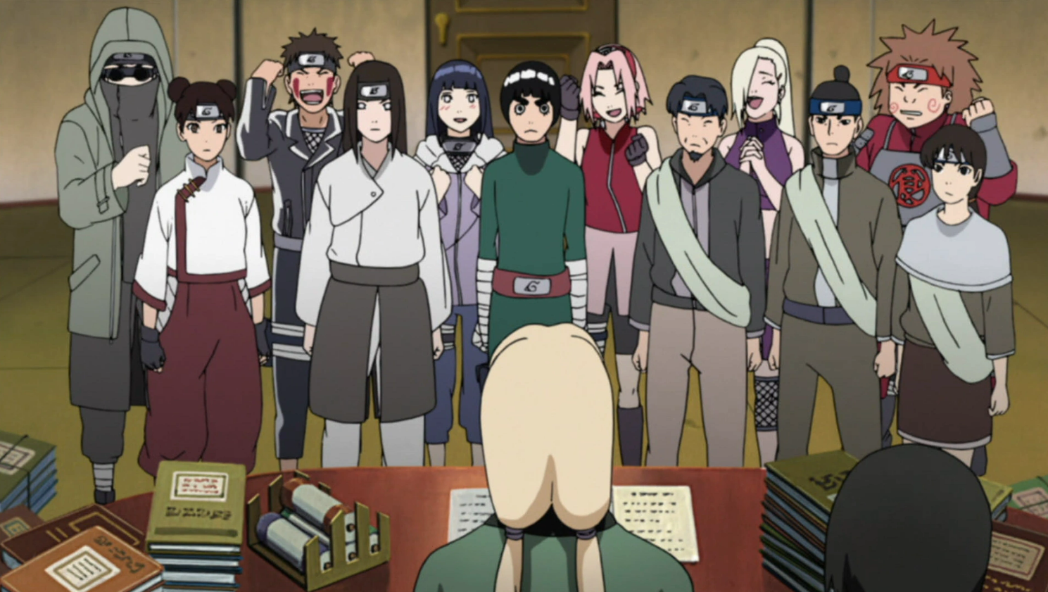 Many characters in Naruto are standing in front of a desk. 
