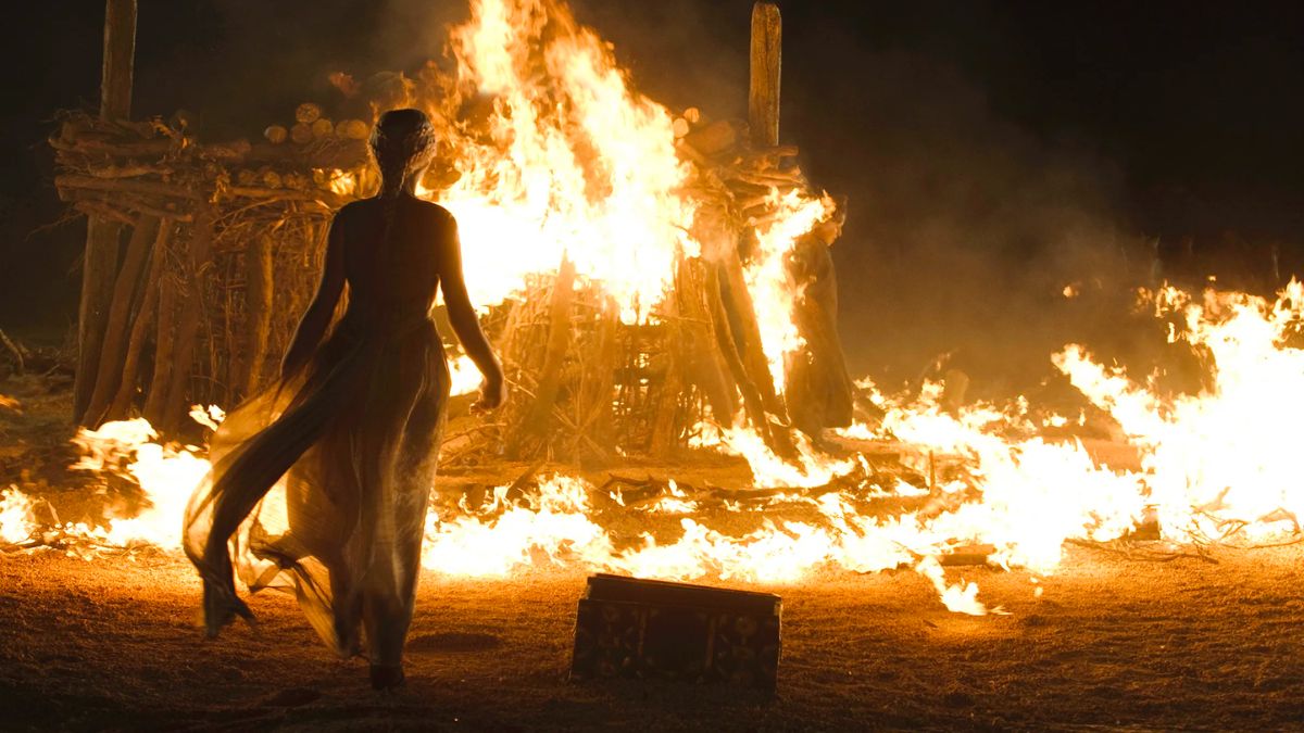 Daenerys walks into the fire.