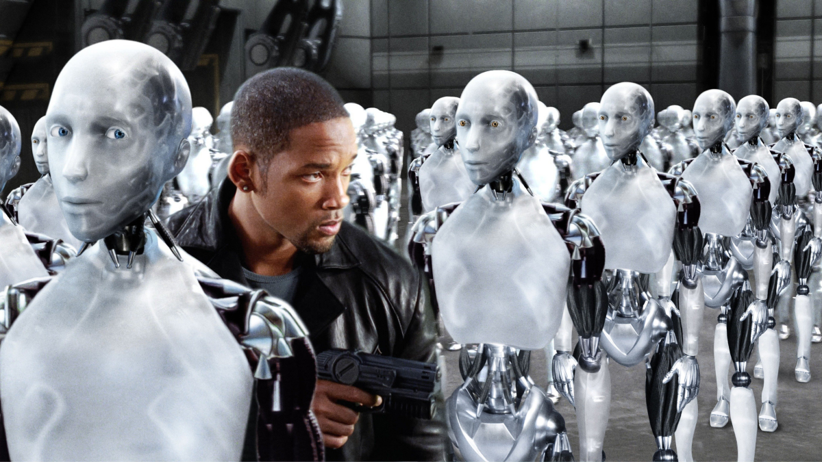 Will Smith walking through lines of robots.