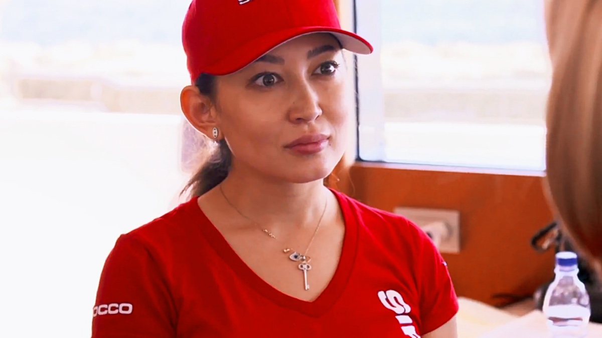 Mila Kolomeitseva in matching red baseball cap and t shirt