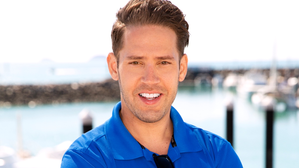 Ryan McKeown smiling in blue polo shirt