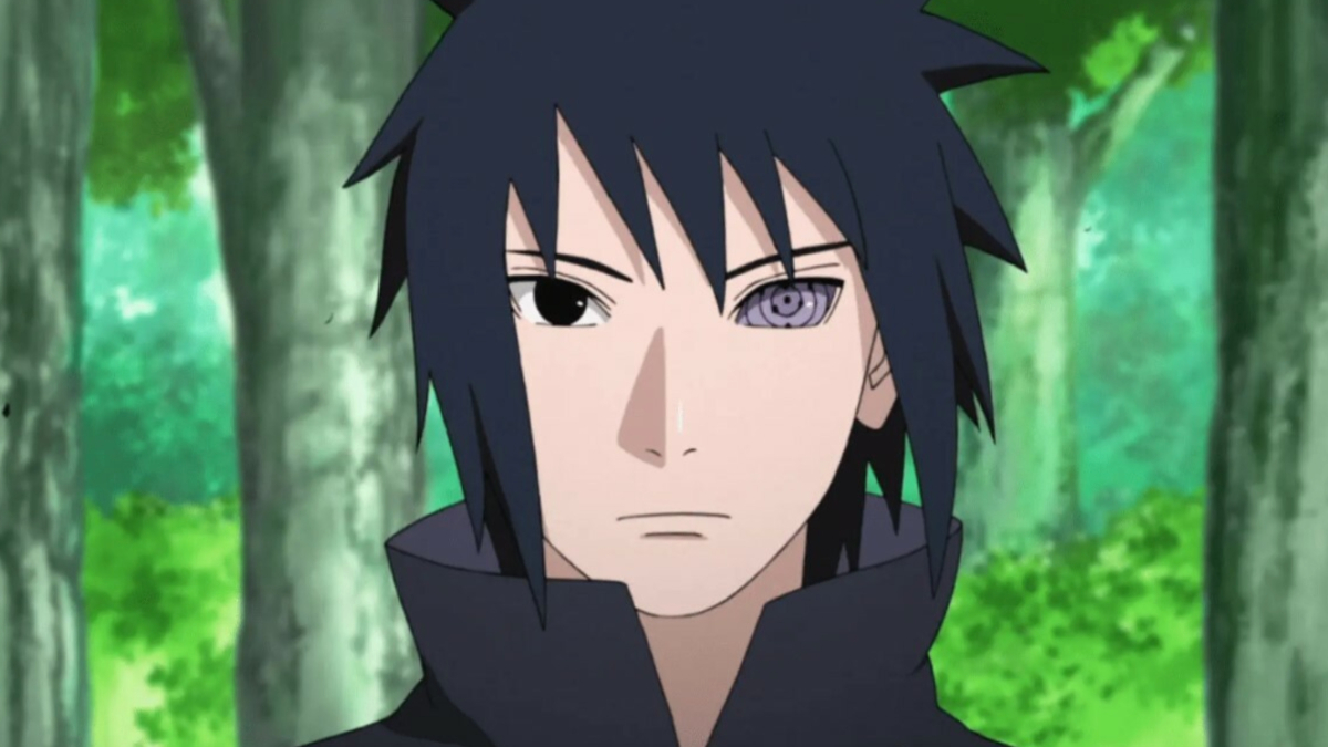 Sasuke is standing in a forest in Naruto.
