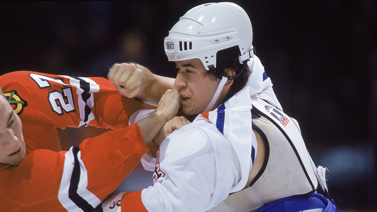 Canadian pro hockey player Terry Ryan, forward for the Montreal Canadiens, and American Ty Jones, forward for the Chicago Blackhawks, fight during a game at the Molson Centre, Montreal, Quebec, October 1998. 