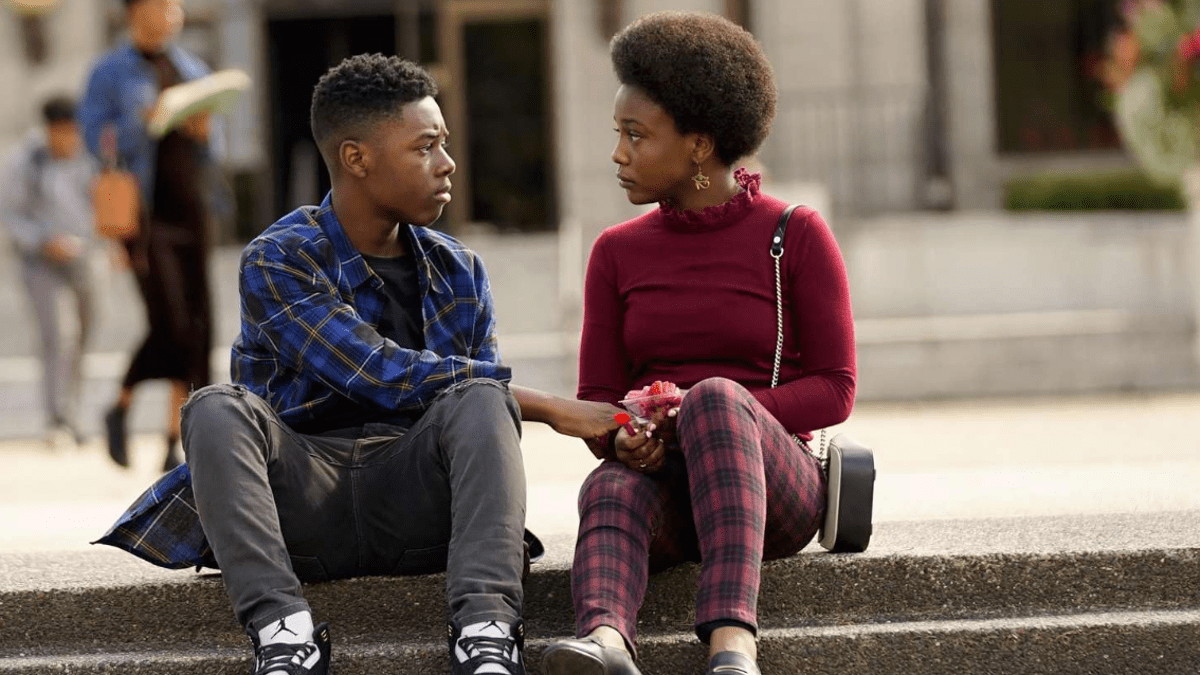 Two characters in "The Chi" are looking at each other.