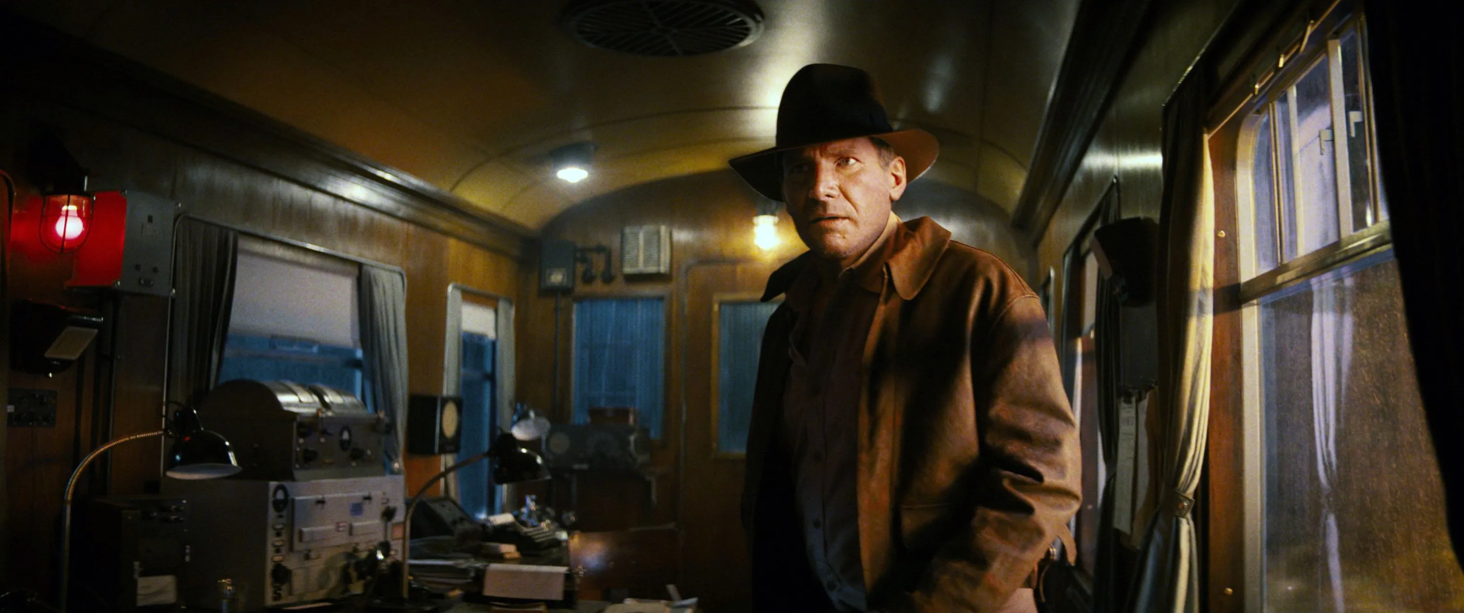Digitally de-aged Indiana Jones, played by Harrison Ford, in a train car in Indiana Jones and the Dial of Destiny.
