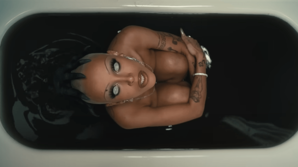 Doja Cat being possessed in a bathtub