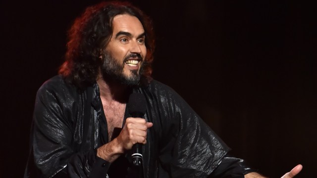 LOS ANGELES, CALIFORNIA - JANUARY 24: (EDITORS NOTE: Retransmission with alternate crop.) Russell Brand speaks onstage during MusiCares Person of the Year honoring Aerosmith at West Hall at Los Angeles Convention Center on January 24, 2020 in Los Angeles, California.