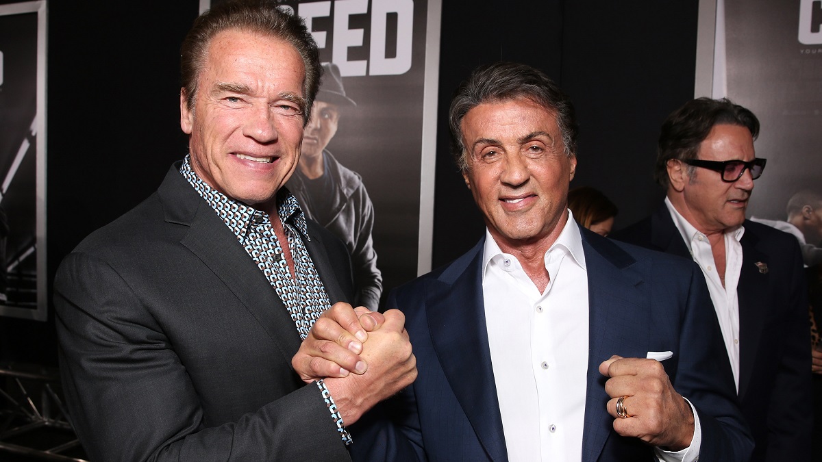 WESTWOOD, CA - NOVEMBER 19: Arnold Schwarzenegger (L) and Producer Sylvester Stallone attend the premiere of Warner Bros. Pictures' "Creed" at Regency Village Theatre on November 19, 2015 in Westwood, California.