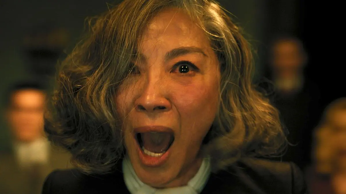 Michelle Yeoh in looking terrified and screaming in A Haunting in Venice