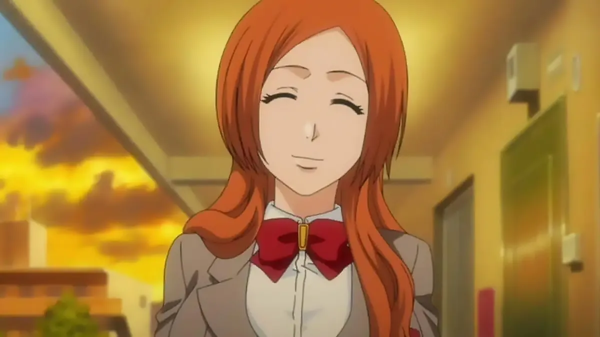 Orihime from Bleach is standing and smiling.