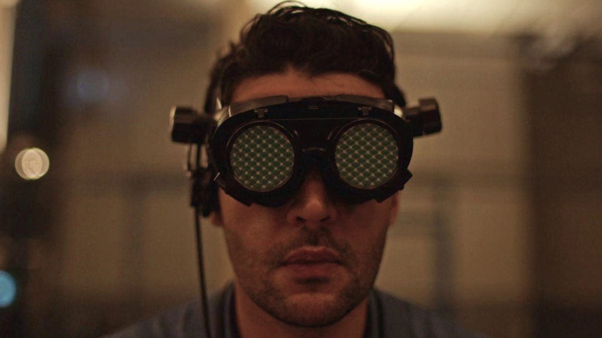 Colin from 'Possessor' wears goggles. 