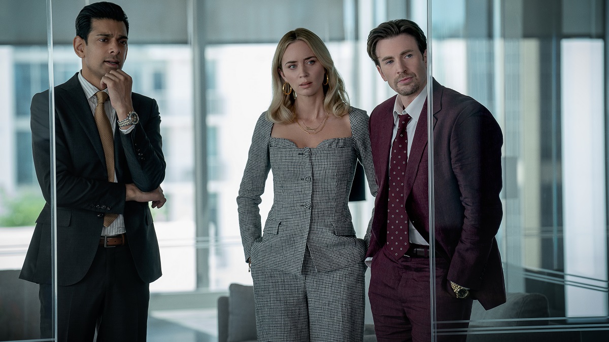 Pain Hustlers - (L to R) Amit Shah as Paley, Emily Blunt as Liza and Chris Evans as Brenner in Pain Hustlers. 