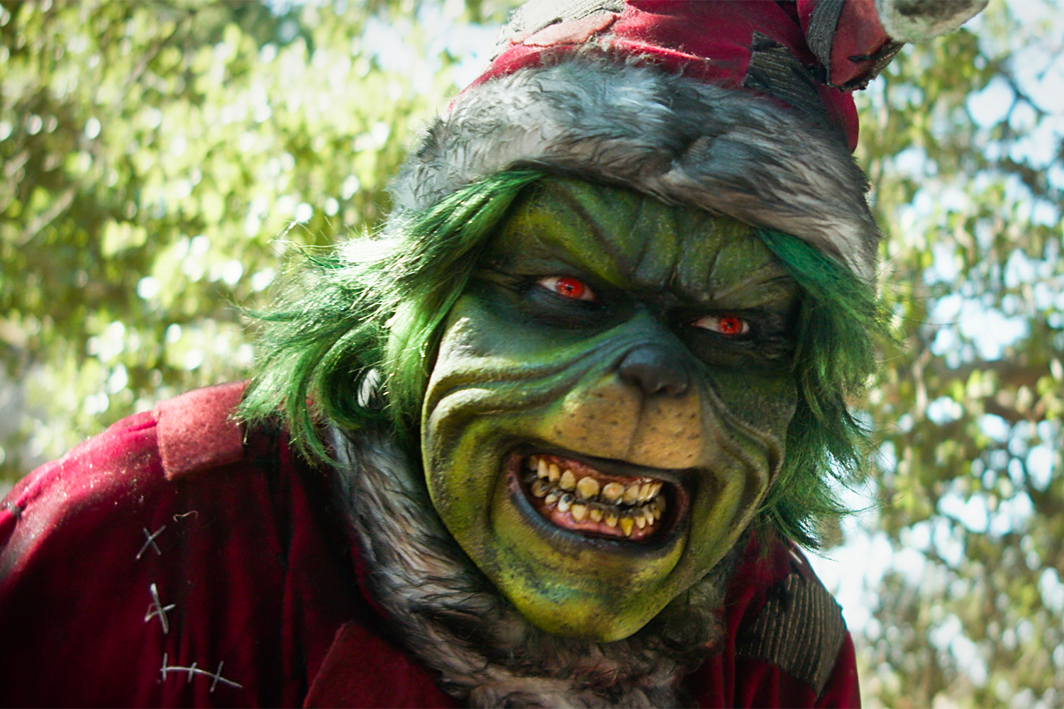 The Grinch from The Mean One grimaces. 