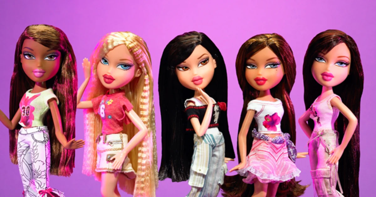 The Bratz dolls are posing against a purple background. 