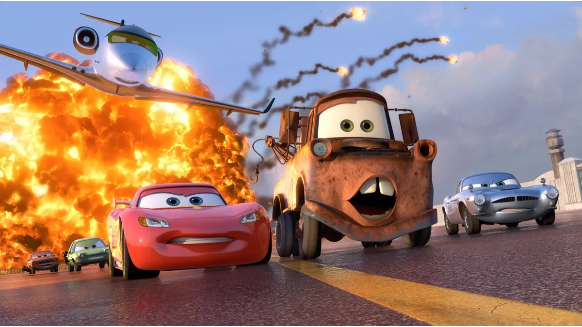 Lightning McQueen and Mater have a fire behind them in Cars 2. 