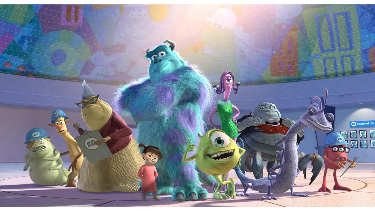 All of the characters in Monsters Inc. are posing for a picture. 