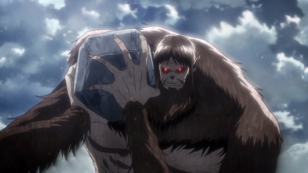 The Beast Titan from “Attack on Titan” enraged and holding a large boulder.