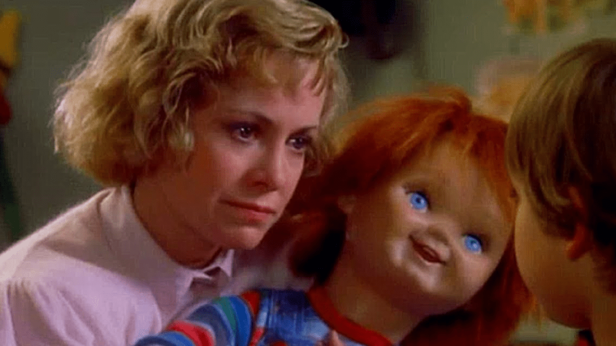 Karen Barclay holding the Chucky doll in Child's Play