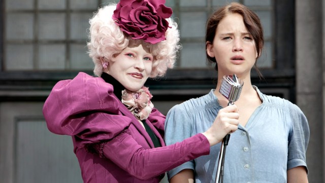 Effie Trinket (Elizabeth Banks, left) and Katniss Everdeen (Jennifer Lawrence) in THE HUNGER GAMES.