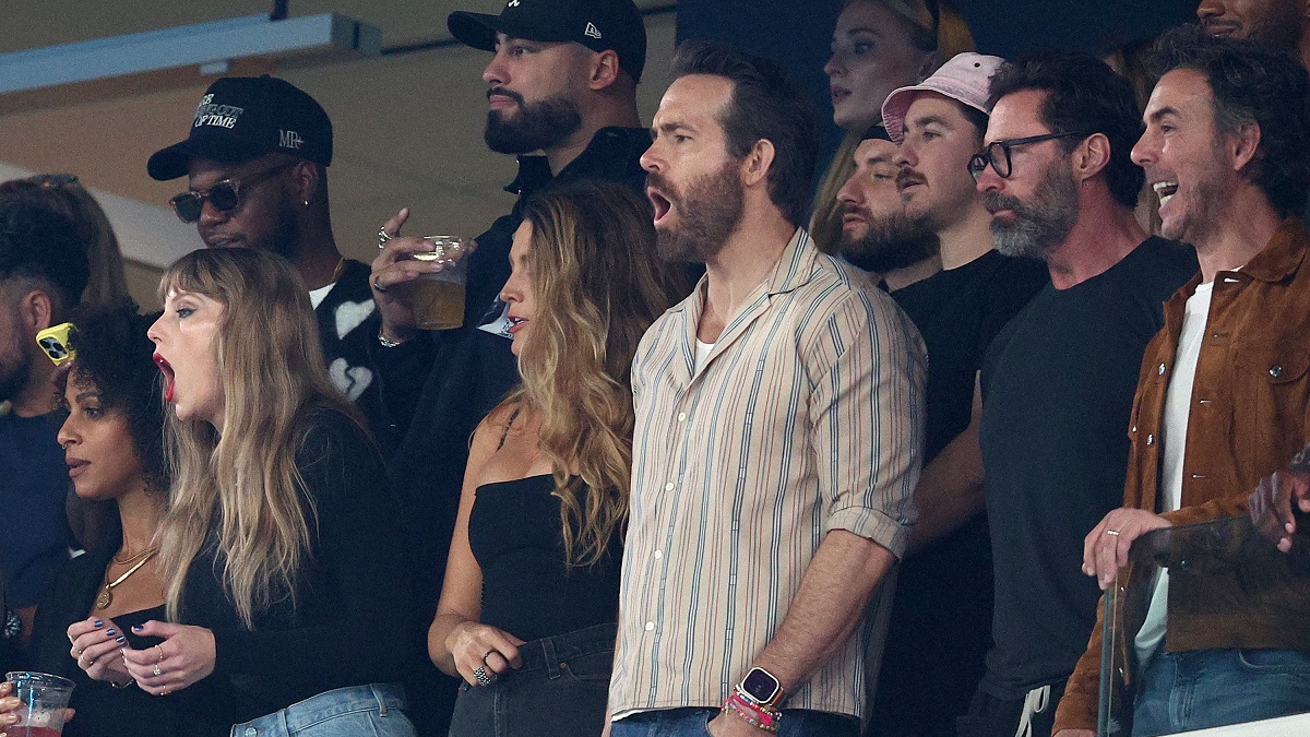 EAST RUTHERFORD, NEW JERSEY - OCTOBER 01: (L-R) Singer Taylor Swift, Actor Ryan Reynolds and Actor Hugh Jackman cheer prior to the game between the Kansas City Chiefs and the New York Jets at MetLife Stadium on October 01, 2023 in East Rutherford, New Jersey.