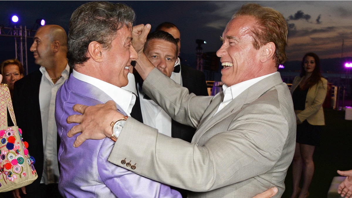 CANNES, FRANCE - MAY 18: Sylvester Stallone (L) and Arnold Schwarzenegger attend "The Expendables 3" private dinner and party at Gotha Night Club at Palm Beach on May 18, 2014 in Cannes, France.