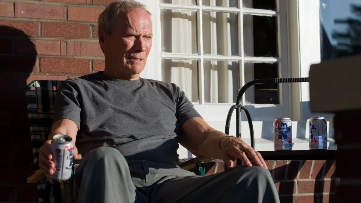 Clint Eastwood sits on the porch in 'Gran Torino'