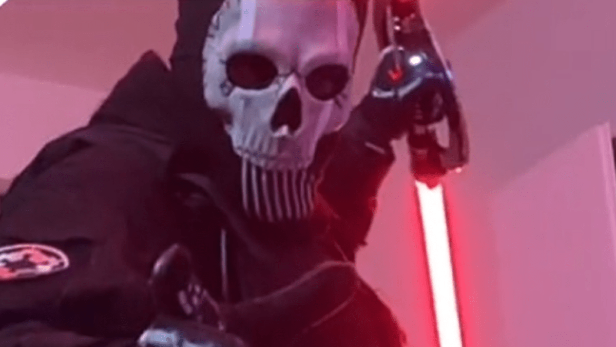 Inquisitor in Ghost cosplay with a lightsaber