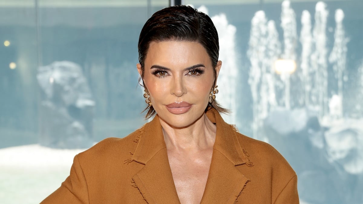 Lisa Rinna in a open-necked brown suit jacket and slicked-back hair at the Jason Wu Collection fashion show during New York Fashion Week