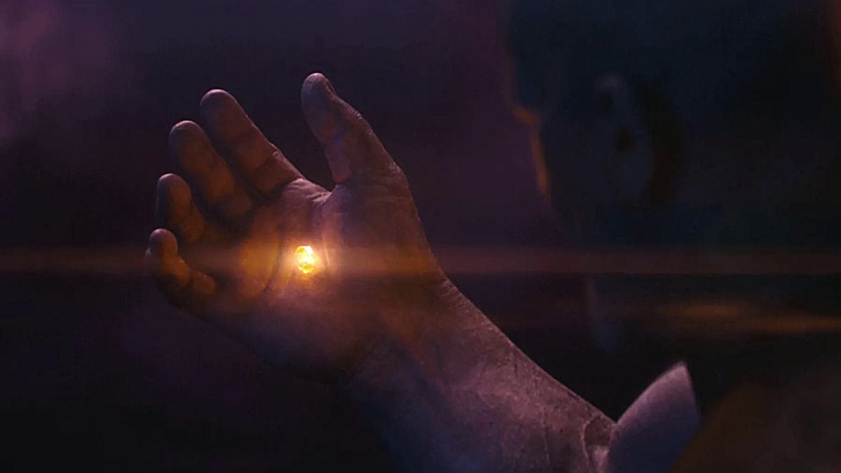 Thanos holds the Soul Stone in his hand after sacrificing Gamora in Marvel Studios' 'Avengers: Infinity War'.