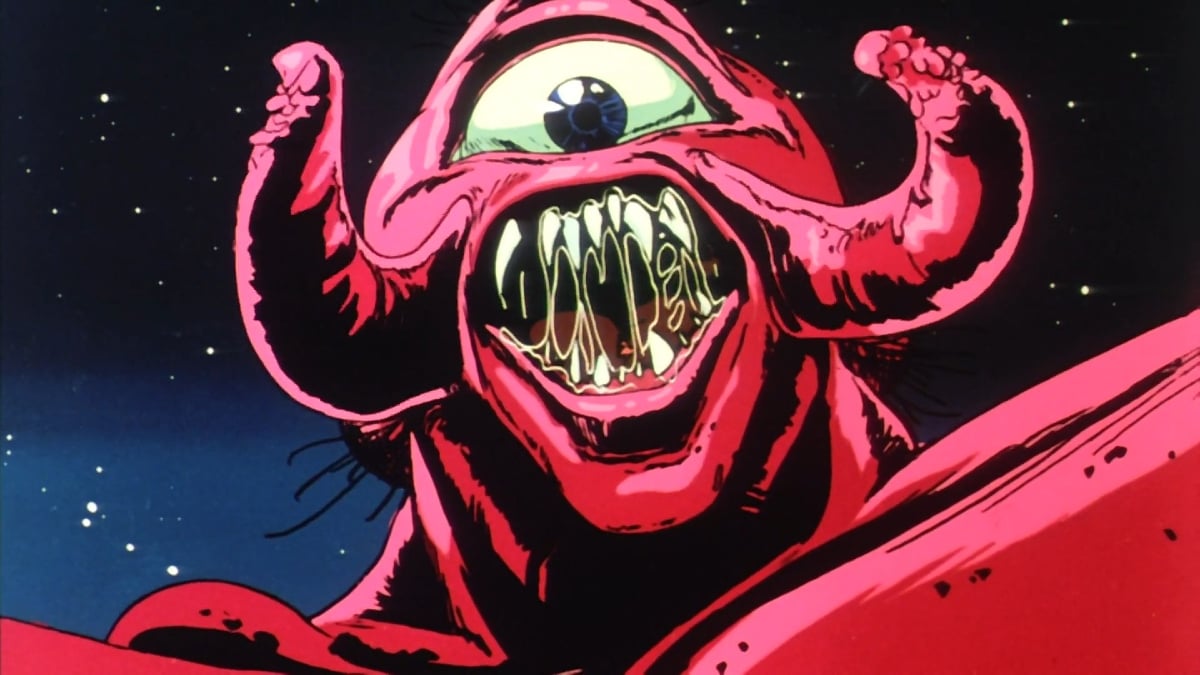 A bright red creature with a single eye, several fangs pointing in various directions with drool dripping down hem, and red tentacle tusks looks menacingly at the viewer.