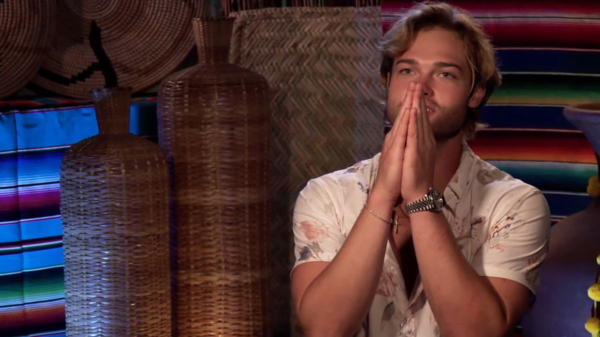 Sean McGlaughlin from Bachelor in Paradise praying to the Paradise Gods