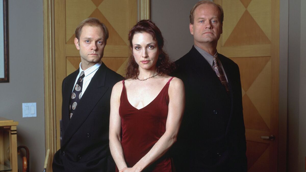 Lilith Sternin (Bebe Neuwirth) stands between Niles (David Hyde Pierce) and Frasier (Kesley Grammer) for a promo image. 