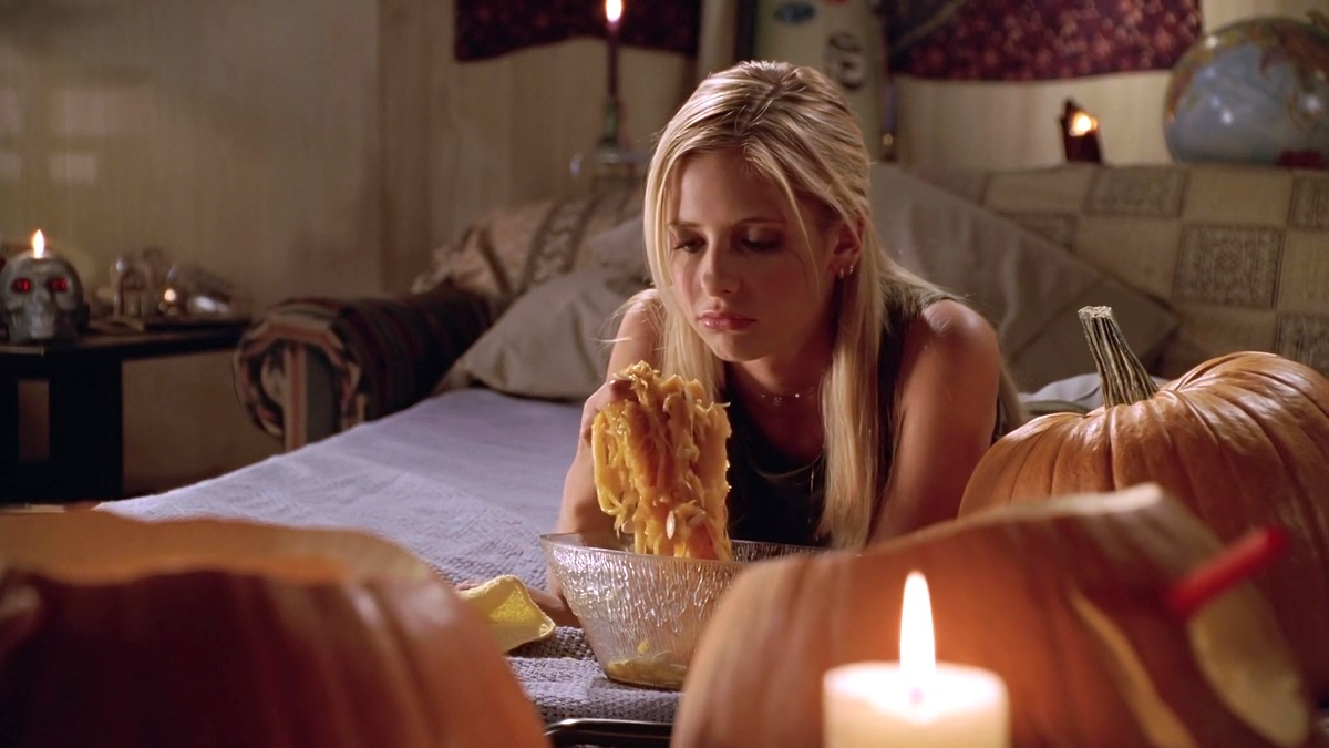 Buffy (Sarah Michelle Gellar) looks glum as she guts a pumpkin in 'Buffy the Vampire Slayer' episode Fear Itself