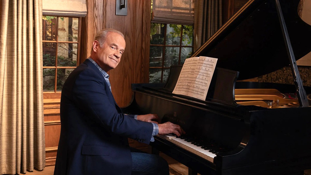 Kelsey Grammer poses by the piano in a promo photo for the 'Frasier' reboot.