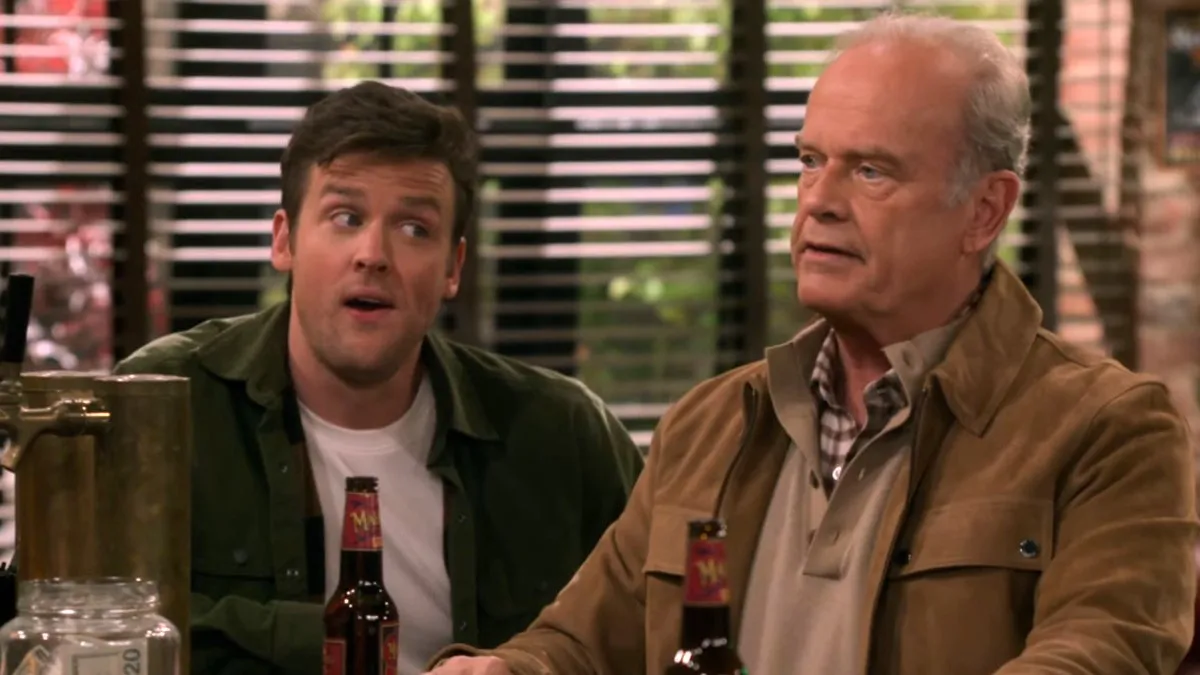 Frasier Crane (Kelsey Grammer) sits at a bar with his son Freddy (Jack Cutmore-Scott) in the 'Frasier' reboot. 