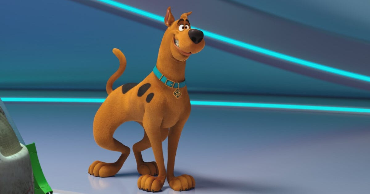 Scooby Doo looks guilty and is standing in a blue room. 