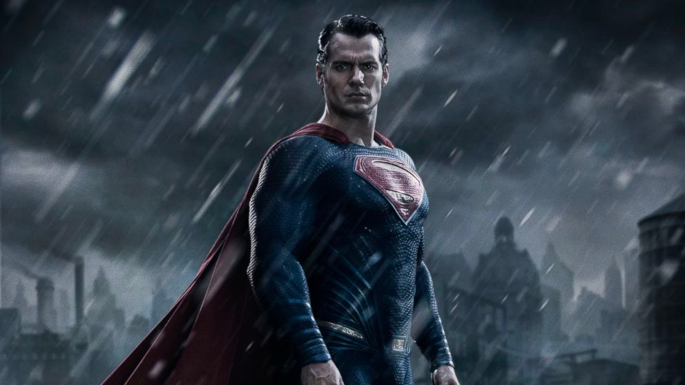Henry Cavill is posing as Superman in the rain in Batman v Superman: Dawn of Justice.