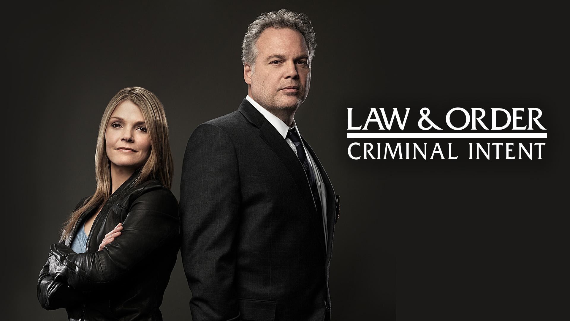 Two characters stand back to back in Law & Order Criminal Intent. 