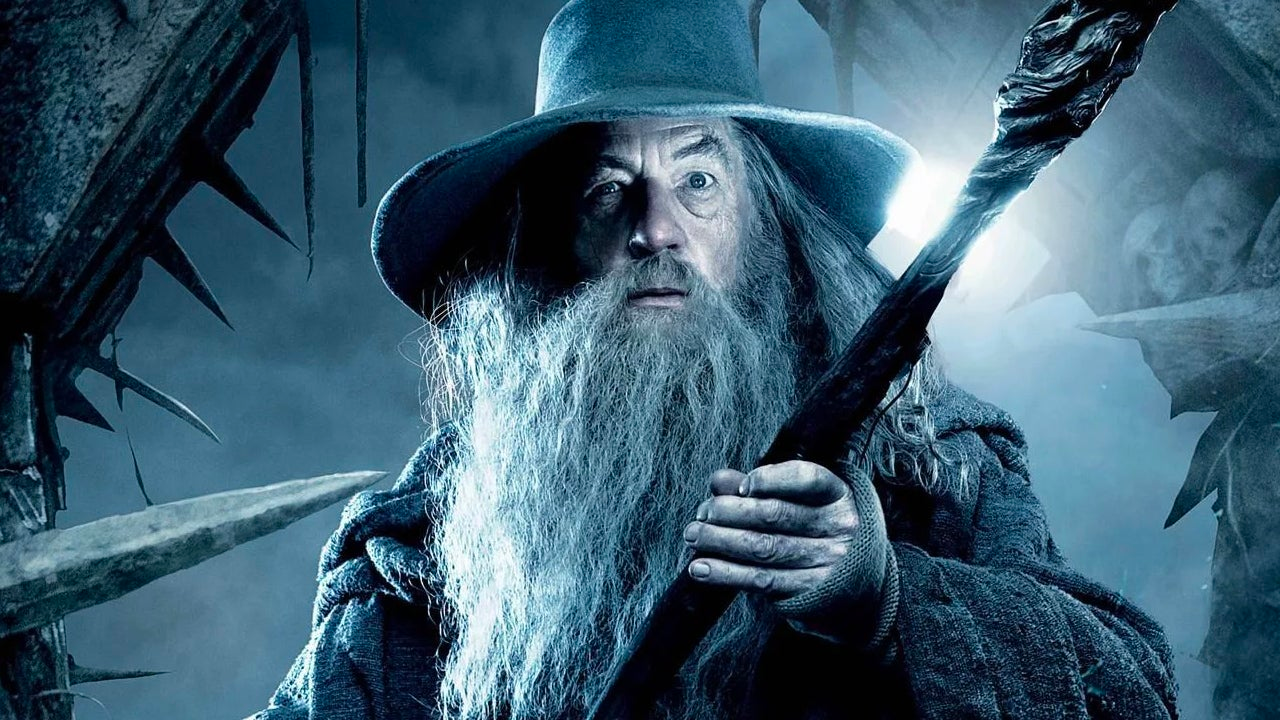Gandalf is holding up a wand in Lord of the Rings.