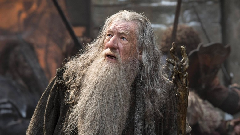 Gandalf is looking into the sky in Lord of the Rings.