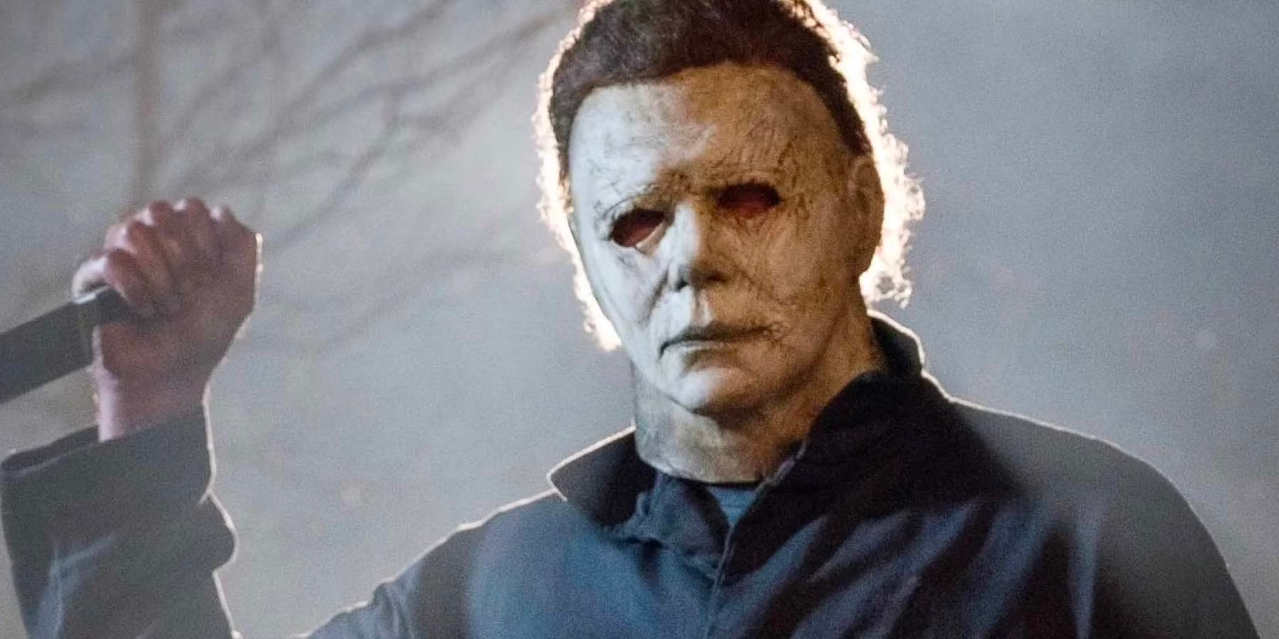 Michael Myers is holding a knife in his hand.