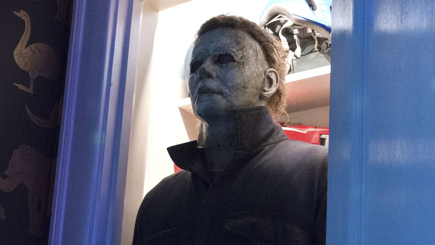 Michael Myers is standing in the doorway of a closet. 