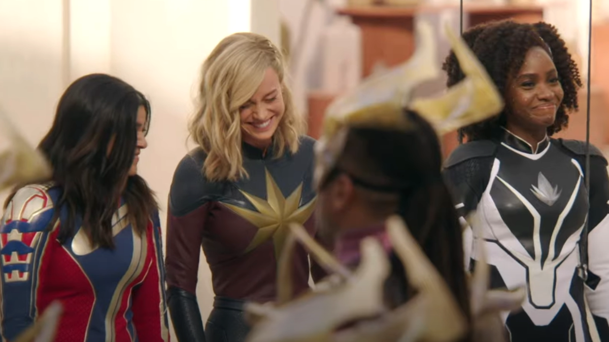 Iman Vellani (L), Brie Larson (C), and Teyonah Parris (R) giggle on set of 'The Marvels.'