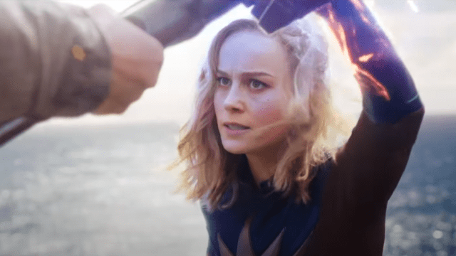 Captain Marvel (Brie Larson) holds back a hammer with a single glowing hand in 'The Marvels'