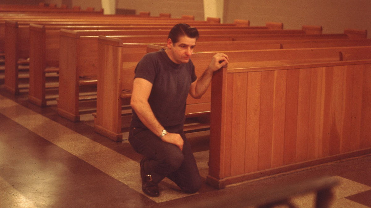 American Albert DeSalvo (1931 - 1973) prays in the chapel at Walpole State Prison, South Walpole, Massachusetts, early 1970s. DeSalvo is the alleged Boston Strangler, a serial killer who claimed at least 11 women's lives between 1962 and 1964, DeSalvo confessed to the murders, but there has always been a shadow of doubt concerning his guilt.