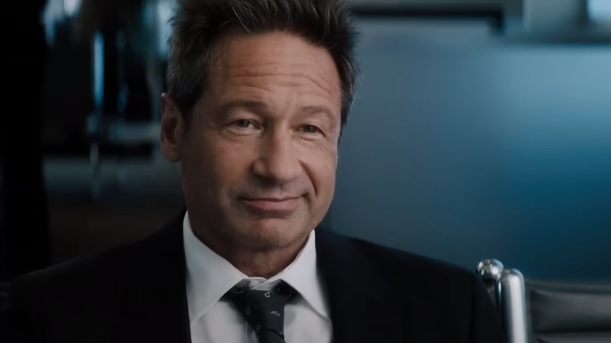 David Duchovny grinning in a still from 'What Happens Later'