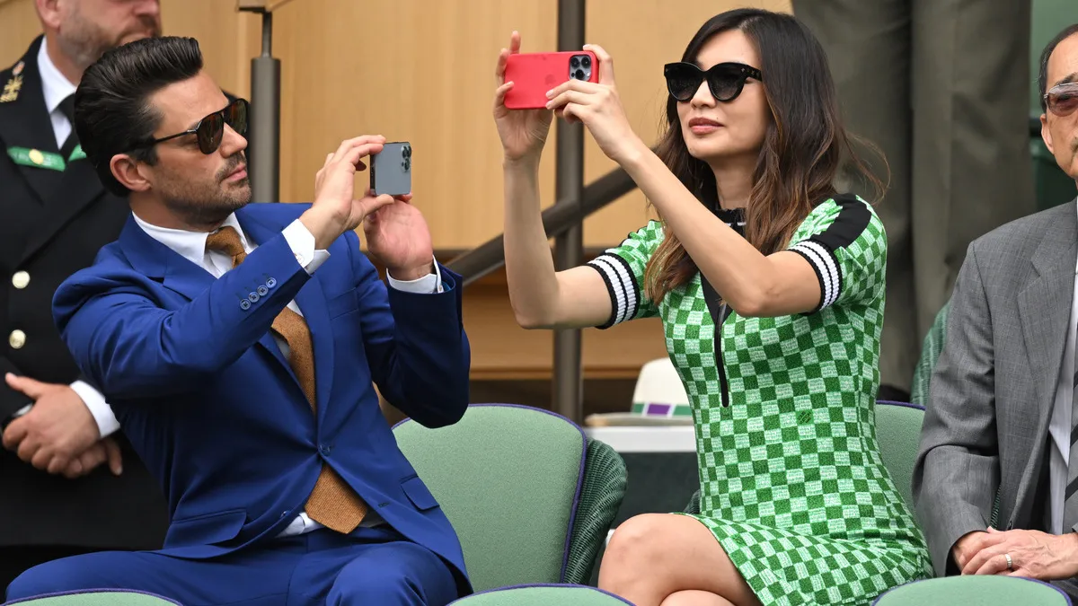 Dominic Cooper and Gemma Chan at All England Lawn Tennis and Croquet Club on July 06, 2022 in London, England. 